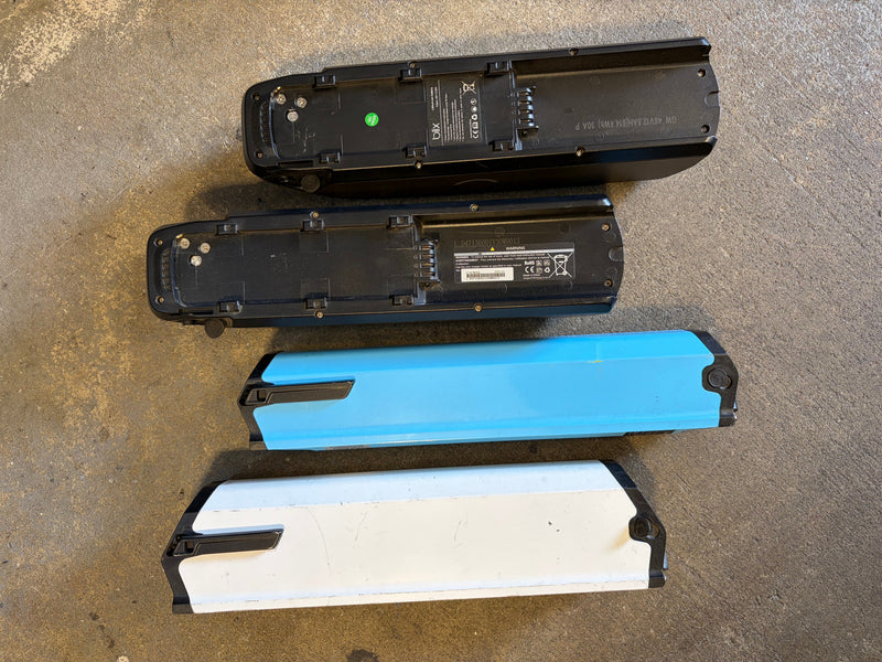 Four Blix batteries showing different generations and form factors
